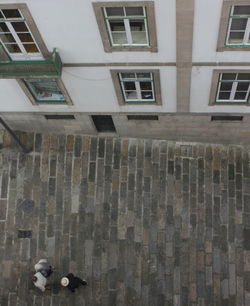 High angle view of people on street against building