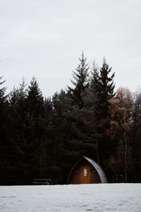 Residential cabin house with wooden facade located in village in winter in scottish highlands