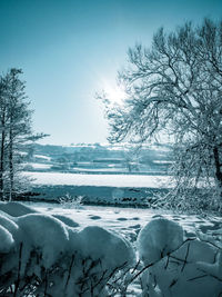 Scenic view of snow covered landscape against clear sky