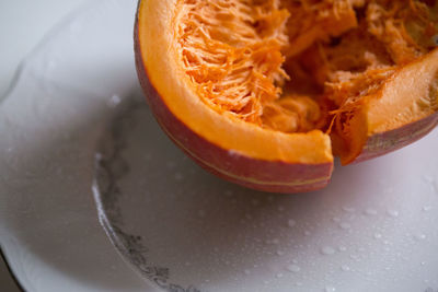 High angle view of orange in plate on table