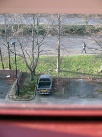 Close-up of car parked on road