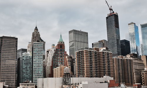 Modern buildings in city against sky