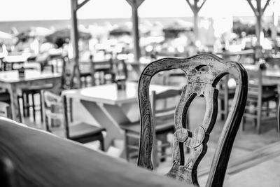 Close-up of empty chairs and tables in restaurant