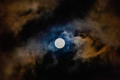 Low angle view of moon against sky at night