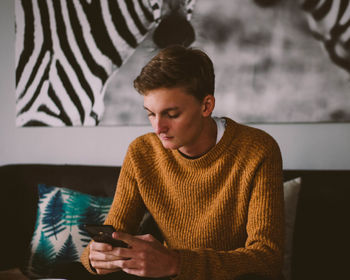 Young man using mobile phone