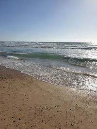 Scenic view of beach against clear sky