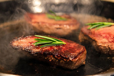 Close-up of meat on barbecue grill