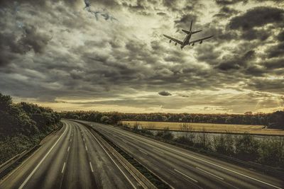 Aerial view of highway against sky during sunset