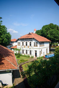 View of buildings against blue sky