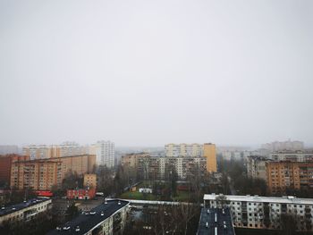 High angle view of buildings in city against clear sky