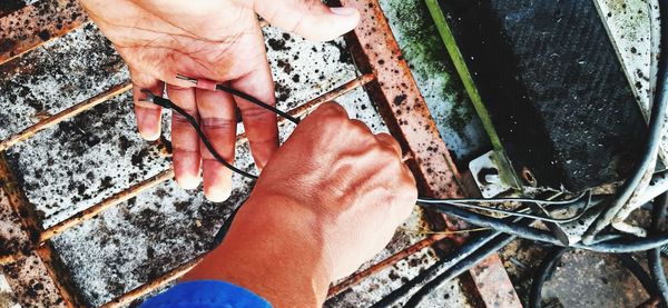 High angle view of man working on metal