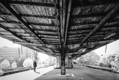 Full length of woman walking on footbridge