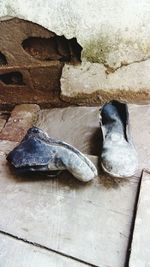 High angle view of abandoned shoes on floor