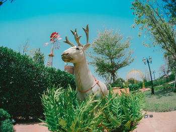 Deer representation amid plants