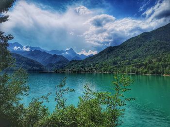 Scenic view of lake and mountains against sky