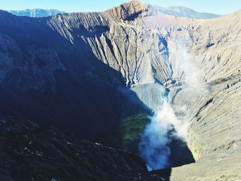 Smoke emitting from volcanic mountain