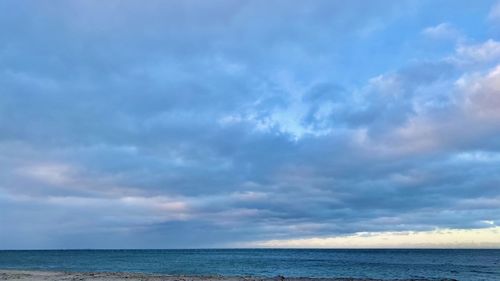 Scenic view of sea against blue sky