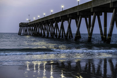 Pier over sea against sky