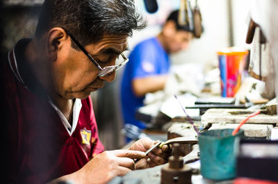 Man working on metal