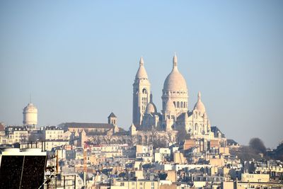 Sacre coeur in city against clear sky