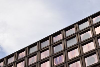 Low angle view of office building against sky