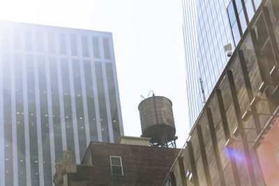 Low angle view of modern buildings against clear sky