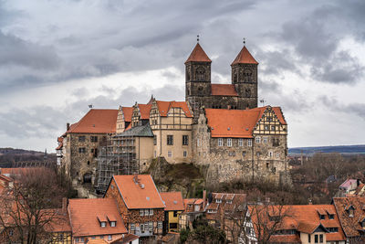 Buildings in city against sky