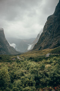 Scenic view of mountains against cloudy sky