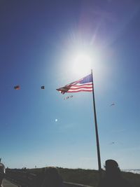 Low angle view of flag against clear sky