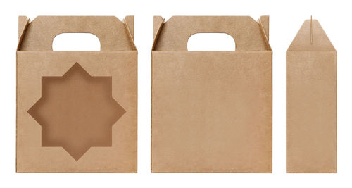 Close-up of various paper bags against white background