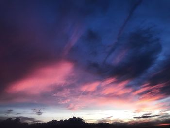 Low angle view of dramatic sky during sunset