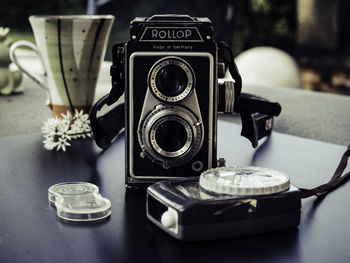 Close-up of camera on table