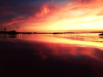 Scenic view of sea against romantic sky at sunset