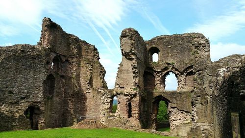 Low angle view of statue against sky