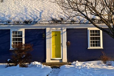 Houses on snow covered landscape
