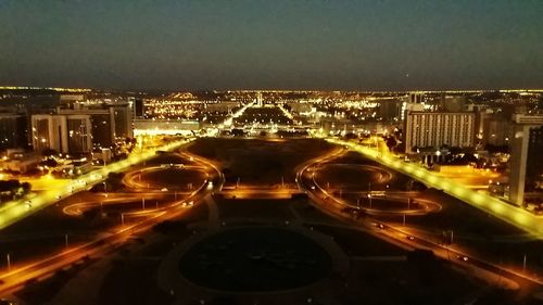 High angle view of light trails on road at night