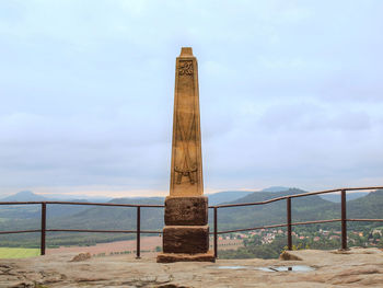 Stony memorial post on lilienstein  against sky