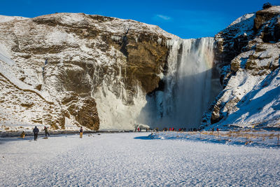 Scenic view of frozen lake against sky