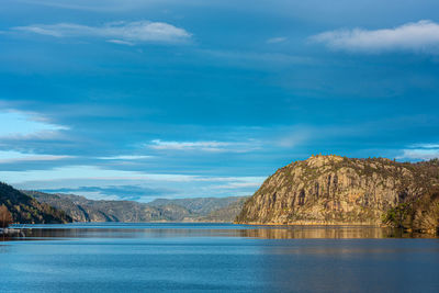 Fjord with steep hills and mountains
