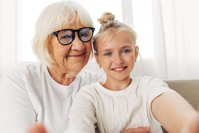 Portrait of smiling young woman at home