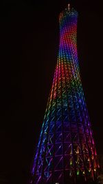 Low angle view of illuminated lights against sky at night