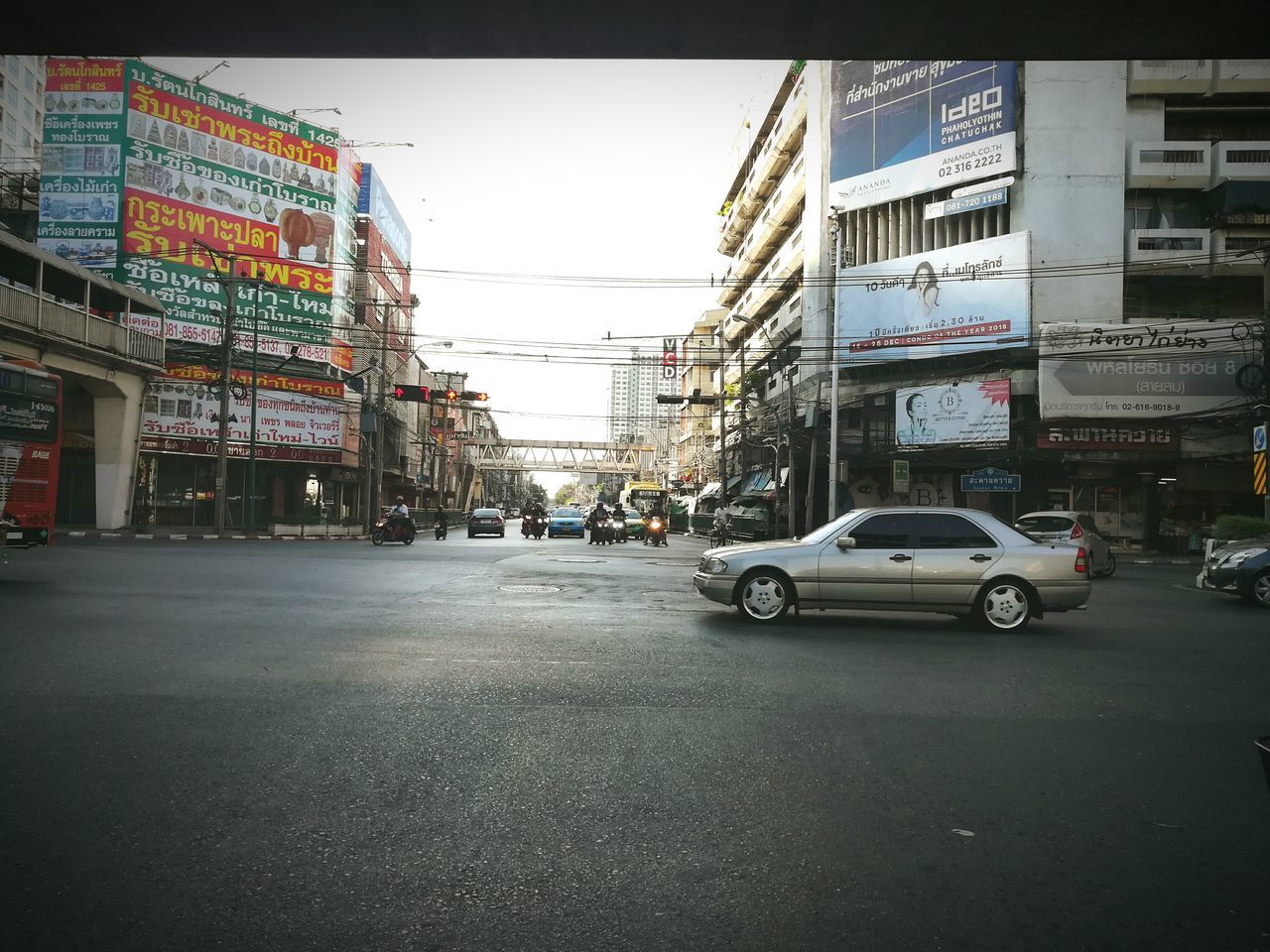 CARS PARKED ON ROAD IN CITY