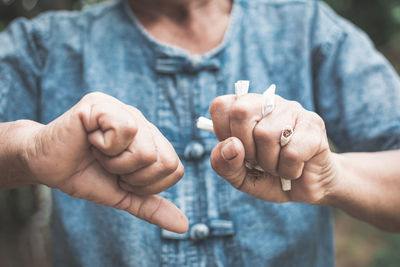 Close-up of man holding hands