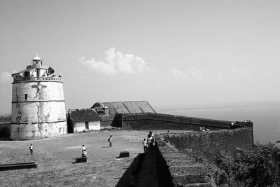 Old lighthouse at fort aguada against sky