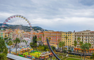 Ferris wheel against sky in city