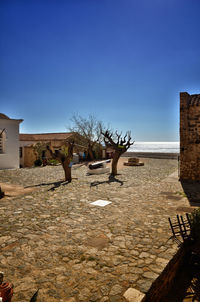 View of old building against clear blue sky