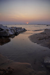 Scenic view of sea against sky during sunset