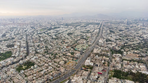 Aerial view of cityscape against sky