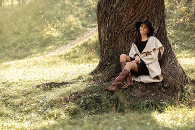 Young woman sitting on field