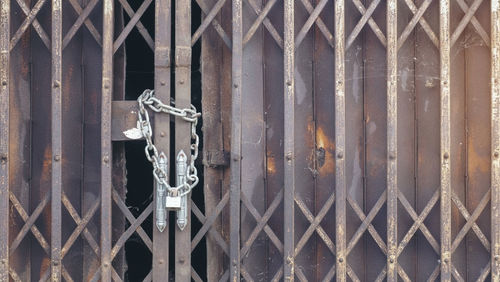 Full frame shot of closed metal gate